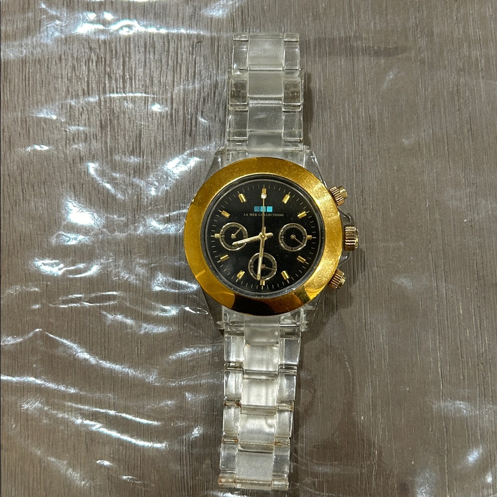 La Mer Collection Gold and Black Chronograph Watch with Clear Strap